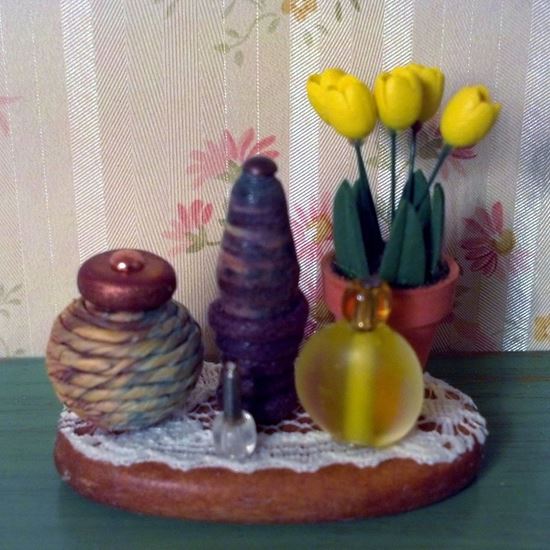 Picture of Second hand dollhouse yellow tulip floral arrangement.