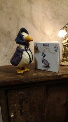 Picture of Dollhouse Jemima Puddle Duck and readable book about her.
