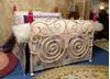 Picture of Handmade Metal Bed w/pink dolls for bed posts.