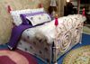 Picture of Handmade Metal Bed w/pink dolls for bed posts.