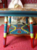 Picture of Hand painted dollhouse table.