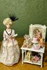 Picture of Full scale hand made doll with a beautiful dressed table