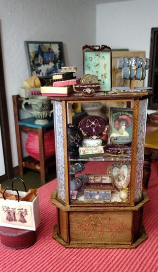 Picture of Jewelry Display Case with jewels and other items.
